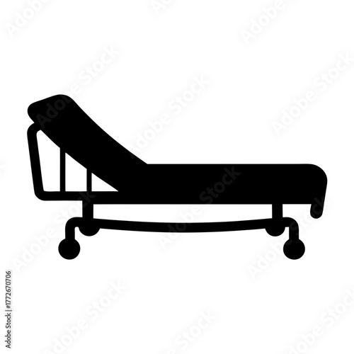 Illustration of a medical examination table with adjustable head rest