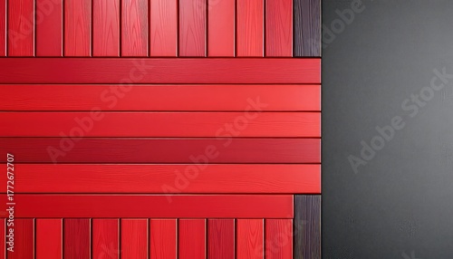 Contemporary wall design featuring a blend of textured grey surface meeting a vibrant arrangement of red and related color wooden planks