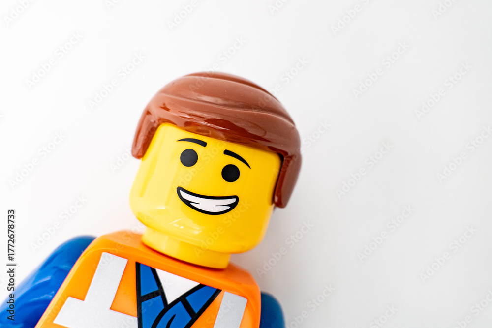 Obraz premium Bradford, UK Oct 30 2025 - Lego Emmet plastic toy shot close up on a white background.