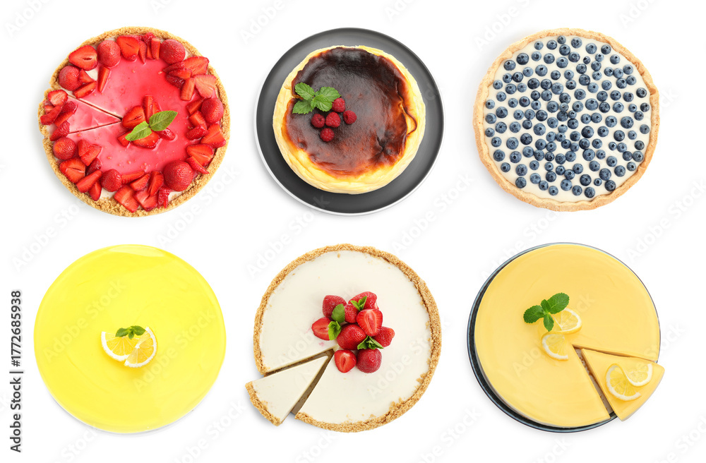 Fototapeta premium Delicious cheesecakes isolated on white, set. Top view