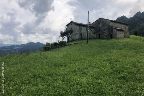 Historical Stone Farmhouse of Zambla Alta Mountain Village, in the Italian Alps, During a Cloudy Day. Beautiful View of Mount Alben Peak, Bergamo Province, Italy