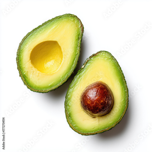 Two avocado halves top view isolated on white background