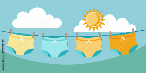 Cloth diapers drying in sunlight on a clothesline with blue sky  