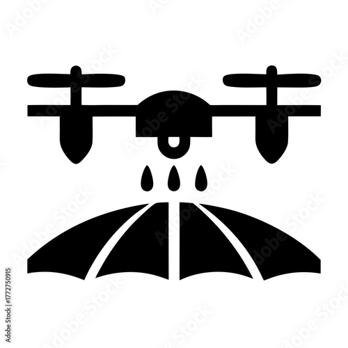 Drone spraying water onto an umbrella silhouette