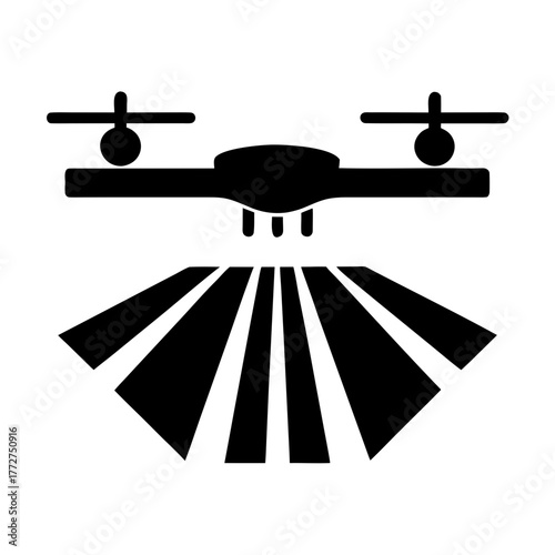 Drone flying over agricultural fields in silhouette