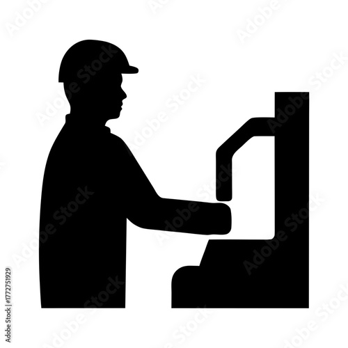 Worker in hard hat operating industrial machinery silhouette