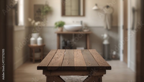 Blurred view of a bathroom highlighting a wooden table, suitable for editorial backdrop