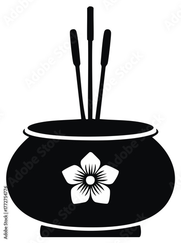 Black and white illustration of an incense burner with reeds and a flower motif