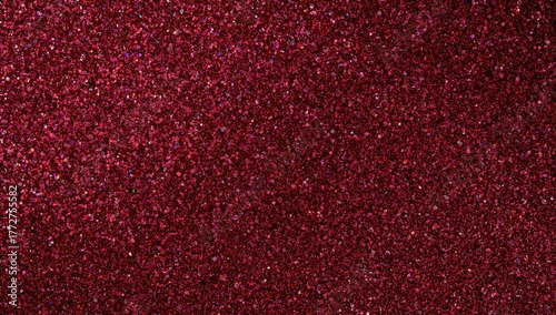 Close-up of a dark red sparkling background created by small sequins, suitable for editorial header background