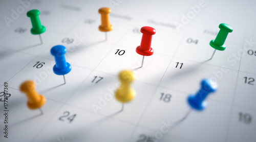 Photos Thumbtack pins in calendar concept for busy, appointment and meeting reminder -