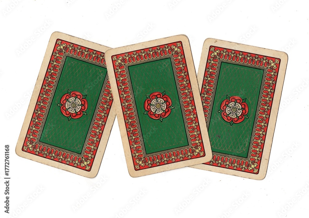 Fototapeta premium A hand of vintage playing card backs isolated on a white background.