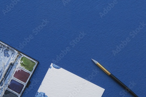 Album and brush with waterc...