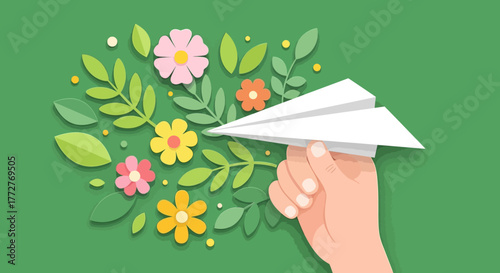 Paper airplane held in hand against a floral background, symbolizing dreams and aspirations,