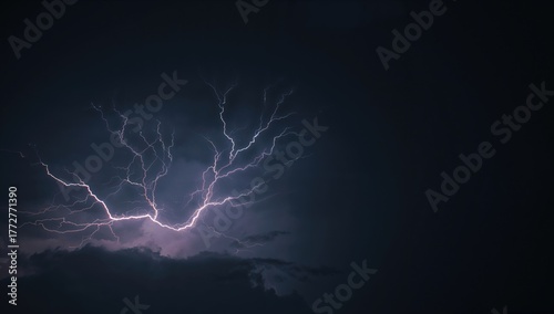 Dark stormy sky illuminated...