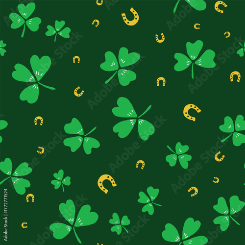 Green gold Saint Patricks Day shamrocks and horseshoes seamless vector pattern. Irish lucky charm motifs. Scattered St. Patricks day symbols for celebration background. Ireland themed backdrop.