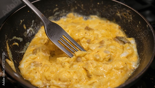 Whisking eggs vigorously in...