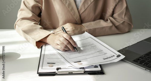 Business woman employer holding resume hiring recruit looking cv resume to hire candidates, analyzing information before job interview. Recruitment concepts