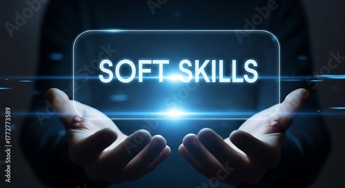 A person holding a digital display with the words soft skills written on it, emphasizing the importance of interpersonal abilities in professional settings and personal development