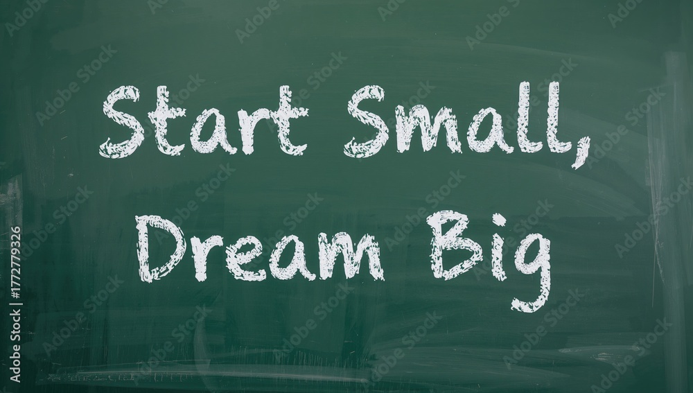 Obraz premium Handwritten inspirational quote 'Begin with small steps, envision greatness' on a chalkboard surface