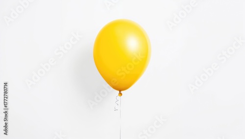 Balloon floating on a white...