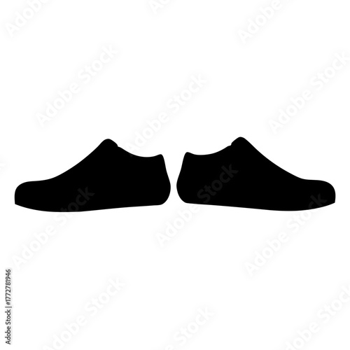 Pair of stylish black shoes silhouette against a plain white background