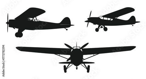 Silhouettes of vintage biplanes in different orientations aviation art