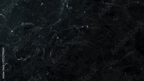 Black calm water surface wi...
