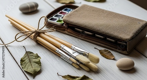 Watercolor Paint Set and Brush Tied Bundle on Rustic White Wood