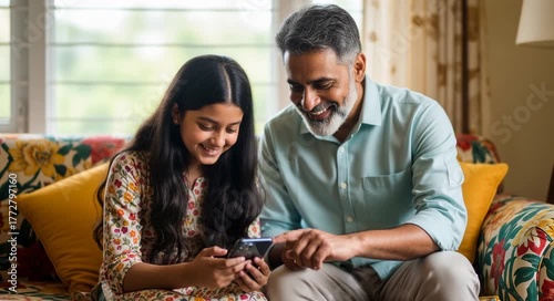 Happy Indian Father and Daughter Using a Smartphone Together on a Sofa generative ai