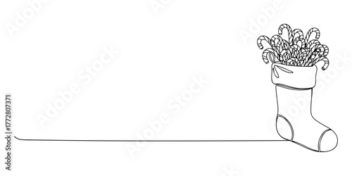 Continuous one line of Christmas stocking filled with candy canes, style hand drawing vector illustration.