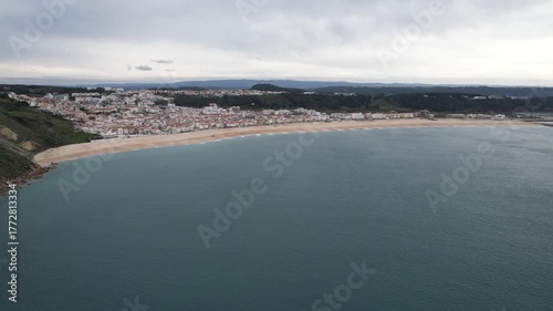 Beautiful coastline and city of Nazare, Portugal on a cloudy autumn day