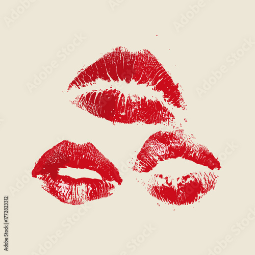 Three red ink lip prints on white background
