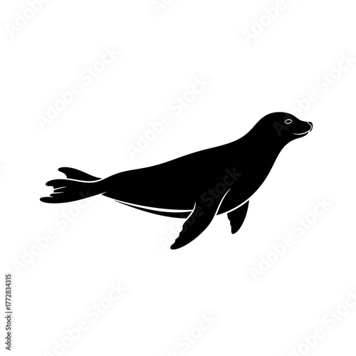 Silhouette of a sleek seal gracefully swimming in the ocean.