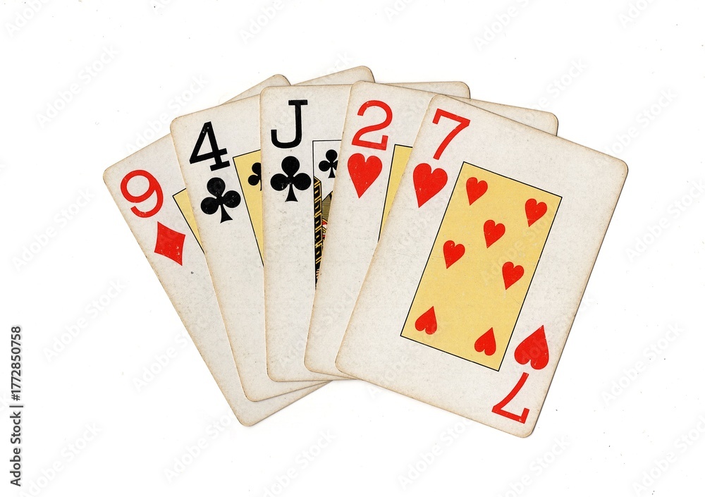 Obraz premium A hand of vintage playing cards isolated on a white background.