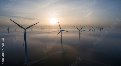 Wind Turbines in Morning Fog with Sunrise Light