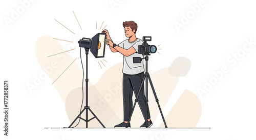 Photographer Readying Equipment for a Professional Photo Session in the Studio Setting