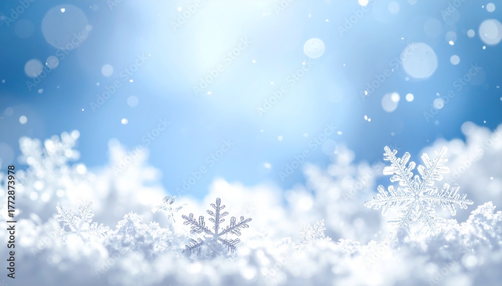 Naklejka premium Magical winter scene with glistening snowflakes in a pile of snow against a soft focus blue sky