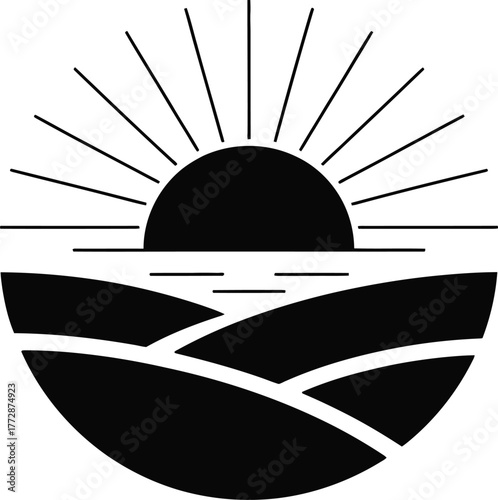 Black silhouette of sunrise over rolling hills