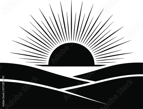 Black silhouette of sunrise over rolling hills