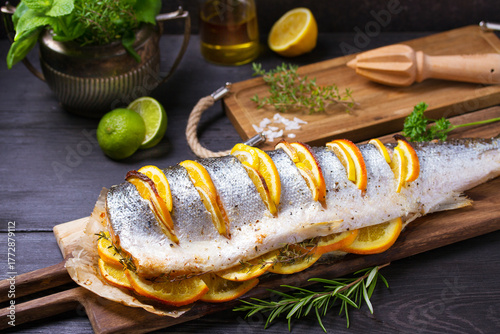 Whole roasted salmon on serving board