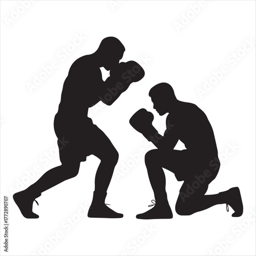 Silhouettes of two boxers in a training session with one standing and one kneeling