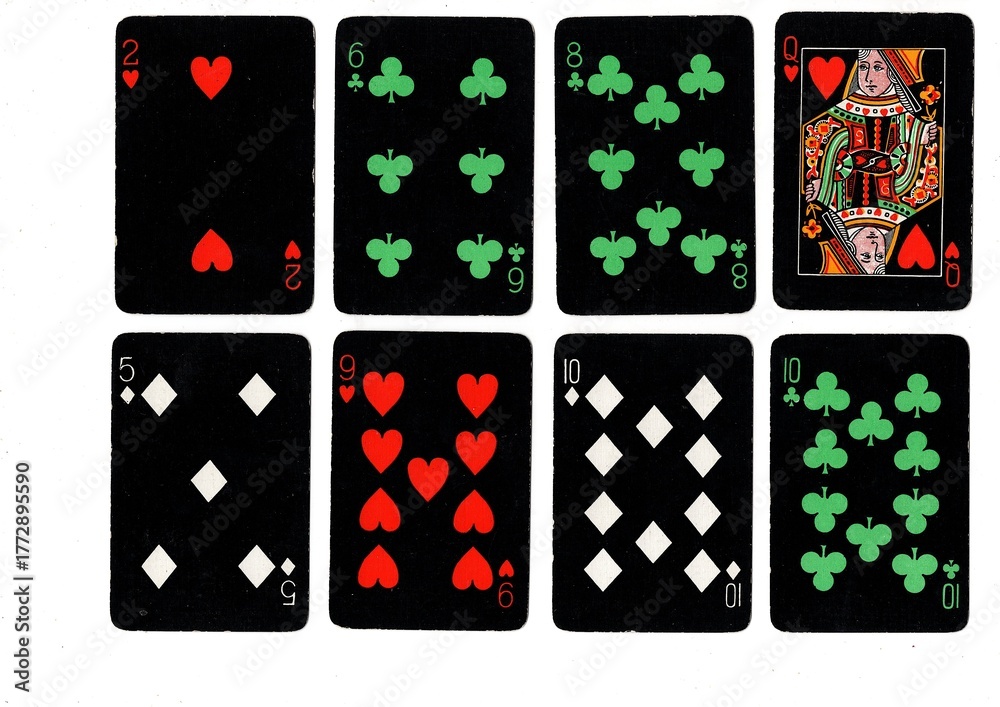 Obraz premium A hand of vintage playing cards isolated on a white background.