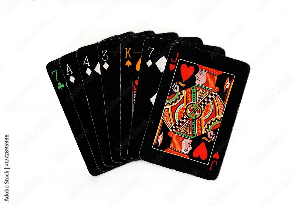 Obraz premium A hand of vintage playing cards isolated on a white background.