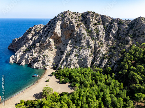 Rocky mountain embracing a secluded beach in Turkiye