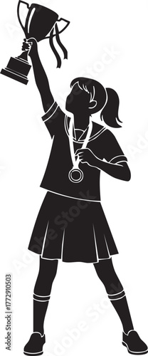 Silhouette of a young girl celebrating victory, holding a trophy high above her head.
