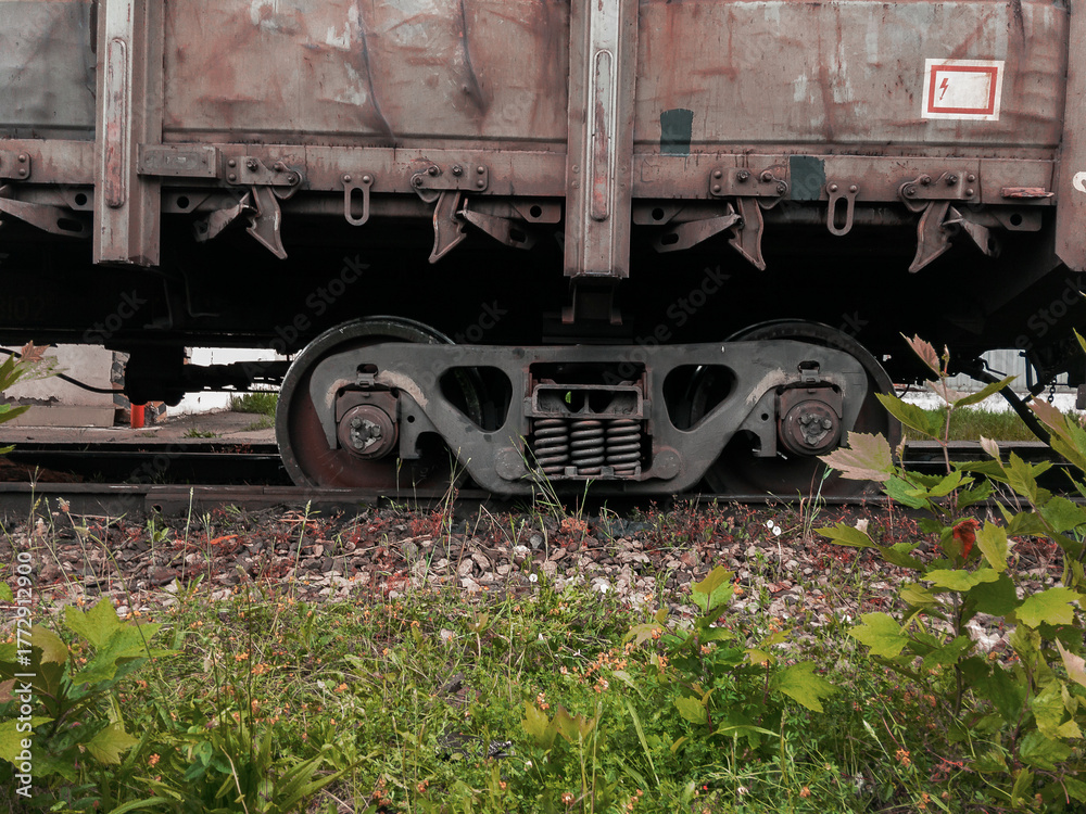 Naklejka premium An accident on the railroad. A railway carriage that derailed on a sunny day. Derailment of railway wagons. As a result of the train accident, the train derailed. A derailed carriage.