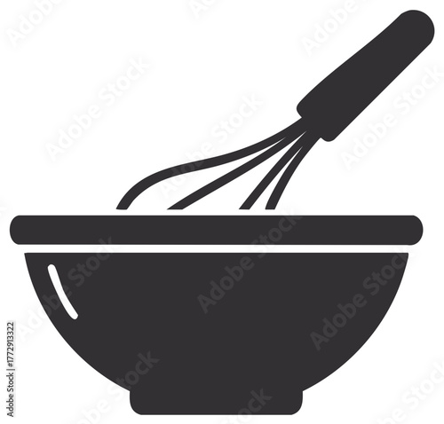 Dark gray kitchen whisk stirring ingredients in a mixing bowl for baking and cooking recipe preparation