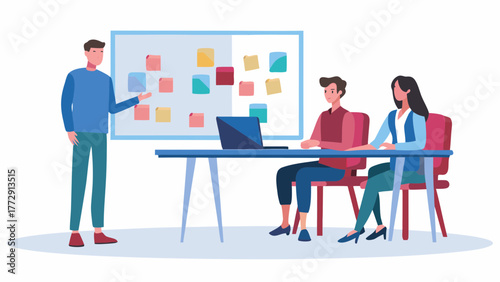 A man presents ideas on a whiteboard to two colleagues sitting at a desk with a laptop in a modern office setting