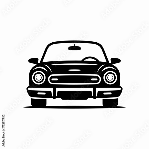 A classic black convertible car is viewed from the front.