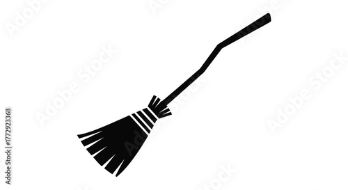 A simple black silhouette of a witch s broomstick with bristles angled upwards against a white background